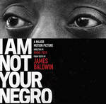 Picture of black man's eyes and face. I am not your negro. James Baldwin in red letters.a